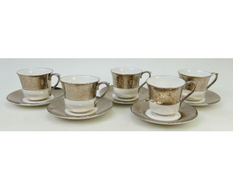 A set of five Tomas Goode Platinum Damask patterned tea cups and saucers (seconds)