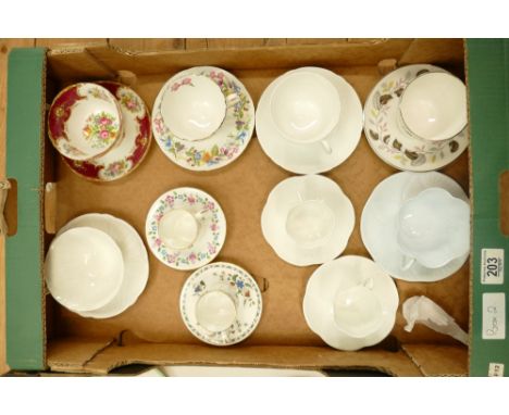 A collection of Shelley cups and saucers: Shelley tea ware in varying shapes and patterns.