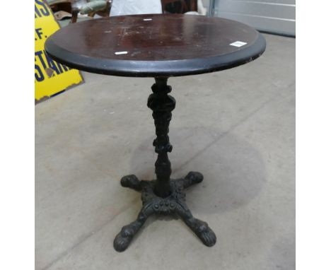 Vintage Pub Table: Cast iron single pedestal pub table with a mahogany top 