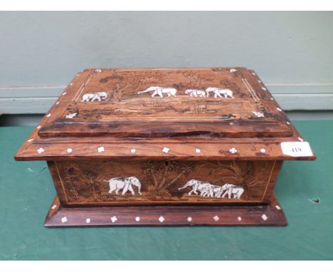 Most unusual jewellery box the exterior decorated with elephants, the interior lined in light blue velvet