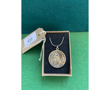 Gold on silver medallion with chain