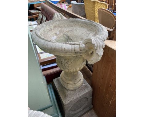 Larger urn shaped stone planter on square base