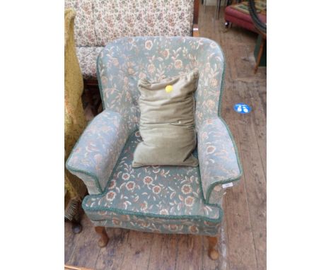 Fireside chair on shaped spud feet, upholstered in light blue ground floral patterned contemporary cloth