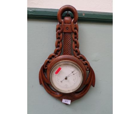 Carved oak cased wall aneroid barometer