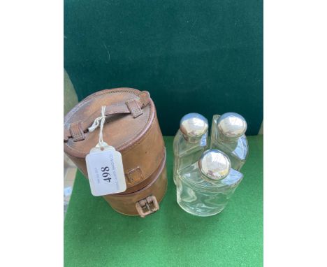 Set of 3 glass silver topped hunting flasks, fitted in pigskin case (London 1904)