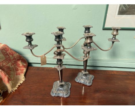 Pair of ornate Sheffield silver plated 3 arm/single candlesticks