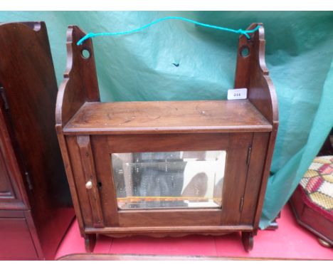 Small mahogany glass door wall cabinet with open upper shelf and single drawer to the interior