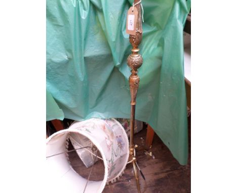 Brass standard lamp with tasselled parchment shade