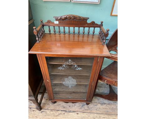 Mahogany 5 shelf storage cupboard on casters inset glazed door, with upper carved gallery 