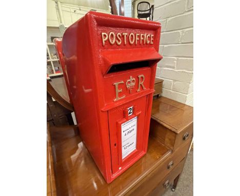 Cast metal post box with keys.