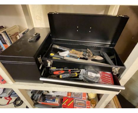 Three metal tool boxes with tools.