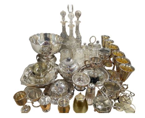 Large collection of silver plate including three bottle tantalus, oval gallery tray, punch bowl, trophy cups, cruet, etc, and