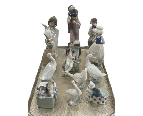 Three Lladro figures and nine Nao pieces.