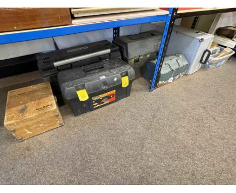 Four tool boxes and assortment of tools including chisels, portable jack, etc.