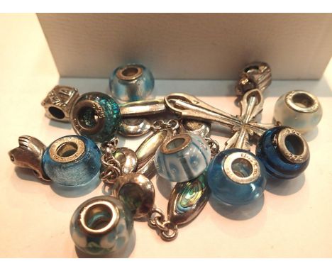 Ten 925 silver and silver mounted charms with a silver and abalone bracelet. P&amp;P Group 1 (£14+VAT for the first lot and £