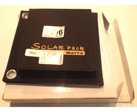 New old stock, 6 watt folding solar panel pack with one USB charging output. Integral part of case with magnetic catch and po