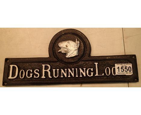 Cast iron Dogs Running Loose sign, L: 31 cm. P&amp;P Group 2 (£18+VAT for the first lot and £3+VAT for subsequent lots) 