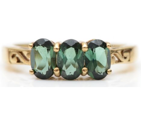 A 9ct gold three stone tourmaline dress ring, O, 2.4gm. 