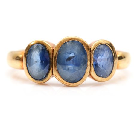 A vintage 9ct gold three stone sapphire ring, L, 3.5gmCondtion report - Sapphires in good condition with polish marks and lig