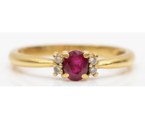 An 18ct gold ruby and brilliant cut diamond ring, O. 2.6gm 