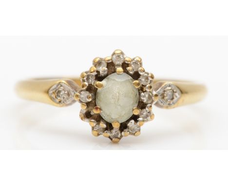 A 9ct gold aquamarine and diamond cluster ring, O, 2.1gm, one stone missing. 