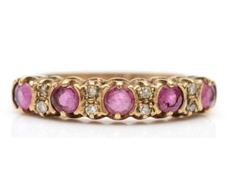 A 9ct gold ruby and eight cut diamond dress ring, I, 1.3gm. 