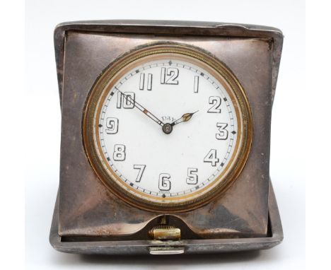 A silver cased travel 8 day clock, Birmingham 1919, opening to reveal the watch, 9 x 9 x 2cm, watch not working