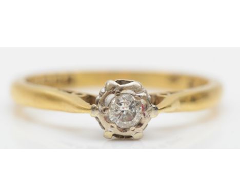 An 18ct gold illusion set brilliant cut diamond ring, L-M, 2.4gm. 