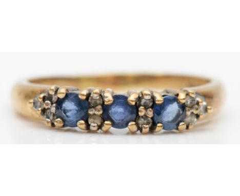 A 9ct gold three stone sapphire and diamond dress ring, O-P, 2.4gm. 