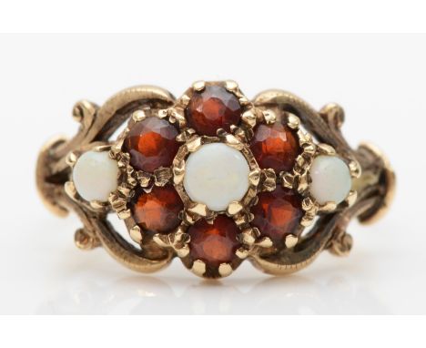 A 9ct gold opal and garnet floral cluster ring, L, 3gm. 