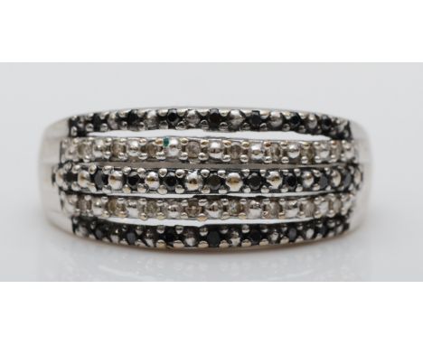 A 9ct white gold black gemstone and diamond dress ring, M, 2.6gm 