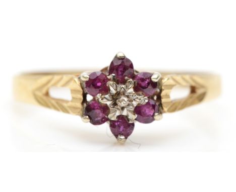 A 9ct gold ruby and illusion set diamond cluster ring, W, 1.9gm. 
