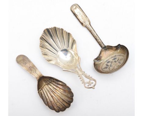A George III silver bright cut caddy spoon, Birmingham 1799, a George III silver shell bowl caddy spoon, repaired and a shell