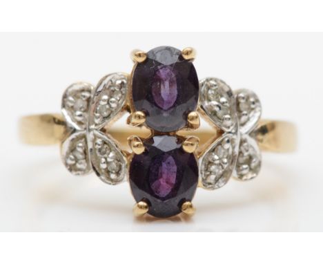 A 9ct gold synthetic colour change alexandrite dress ring, set with diamond butterfly shoulders, N-O, 3.1gm. 