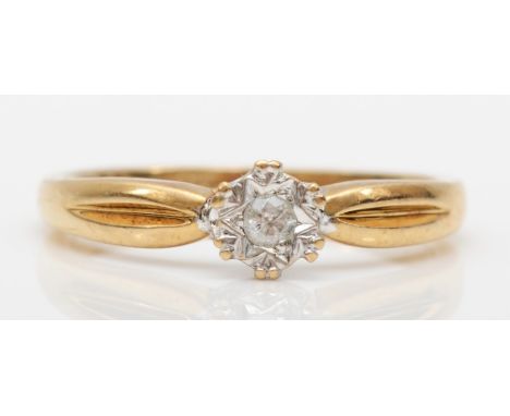 A 9ct gold and brilliant cut diamond single stone illusion set ring, M, 2.1gm 