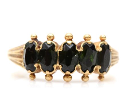 A 9ct gold and five dark green gemstone ring, N, 2.3gm 