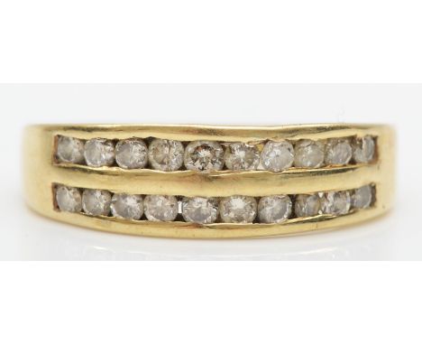 A 9ct gold channel set brilliant cut diamond dress ring, L-M, 2.2gm. 