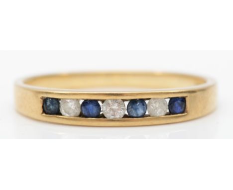 A 9ct gold brilliant cut diamond and sapphire channel set ring, S, 2gm. 
