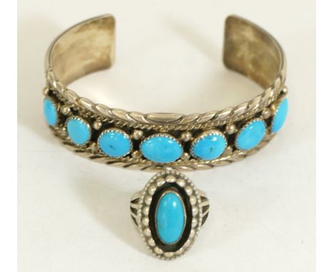 A Native American Sterling silver and turquoise bangle by JS and a similar ring, 43gmCondition report - Both items have small