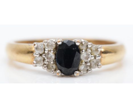 A 9ct gold sapphire and CZ dress ring, P, 3.4gm. 