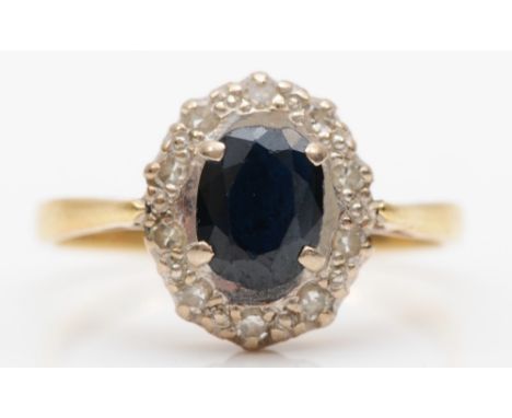 An 18ct gold sapphire and diamond cluster ring, M, 2.7gm. 