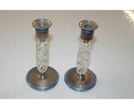 A pair of Adie Bros. silver and blue enamel decorated glass candlesticks, 1928