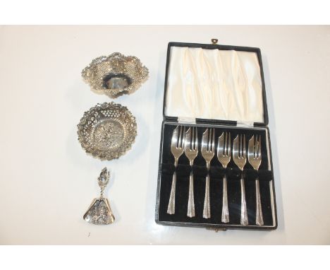 A cased set of six silver plated pastry forks; two pierced silver dishes approx. 45gms; and a white metal caddy spoon