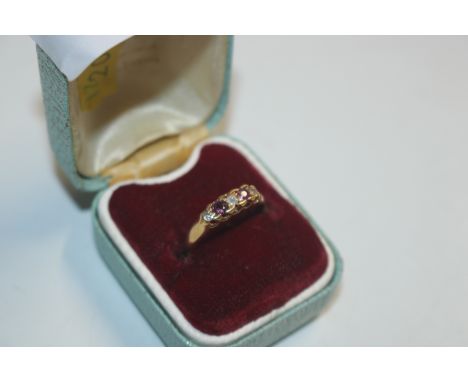 An 18ct gold ruby and diamond set ring, ring size O, approx. 2.5gms total weight 