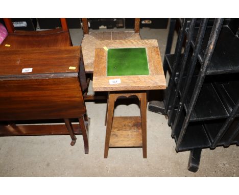 An Edwardian two tier tile top plant stand 