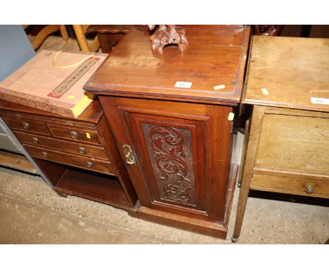 An Edwardian pot cupboard with carved panel door 