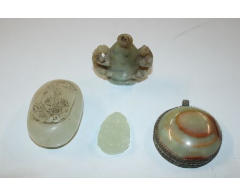 A carved jade snuff; a carved jade pebble pendant; and two other hardstone pendants