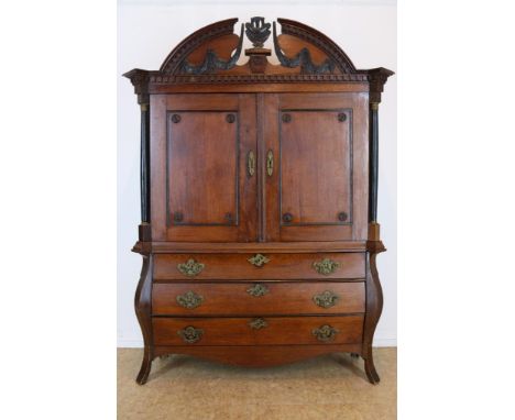 Oak cabinet with carved elements on top, two panel doors and 3  drawers, Holland 18th century, h. 223 w. 152 d. 50 cm.Eiken D