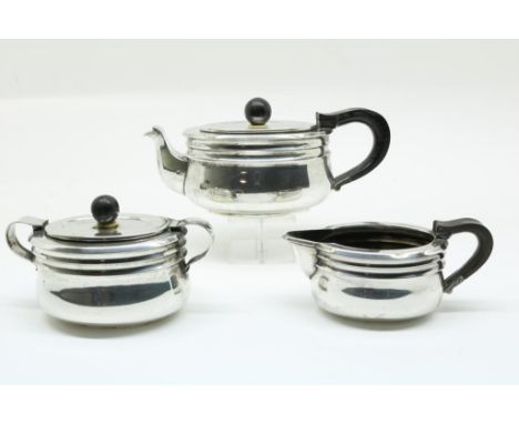 Three piece Dutch silver tea service, two concave bands below the  upper edge and ball shaped finals, mm Zilver fabriek,  Voo