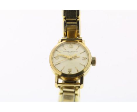 Gilded lady's wristwatch, manual winding, Baume &amp; Mercier, with  gilded stretch wrist band, case diameter ca. 18 mm.Vergu